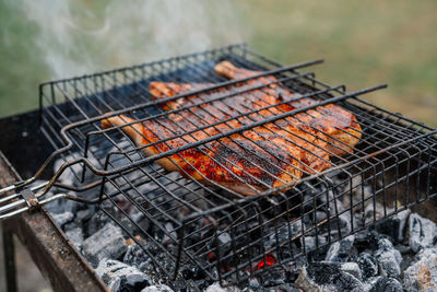 High angle view of meat on barbecue grill