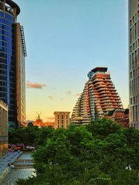 View of city buildings against clear sky