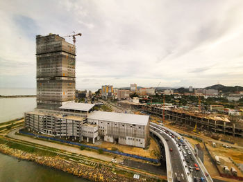 High angle view of city street and buildings against sky