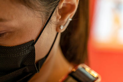 Close-up of man using mobile phone