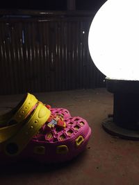 Close-up of illuminated lamp on table