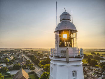 High angle view of lighthouse amidst buildings in city