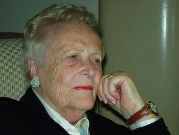 Senior woman wearing lipstick at home