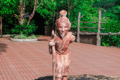 Statue against trees in park