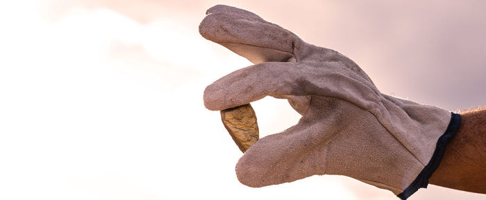 Close-up of human hand against white background