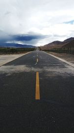 Road amidst landscape against sky