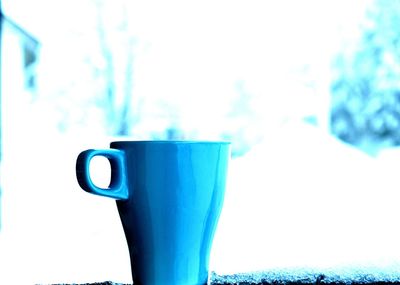 Close-up of coffee cup on table