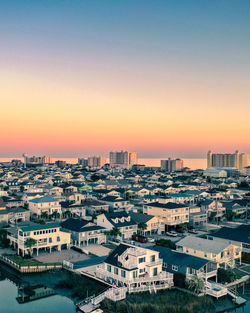 High angle view of townscape against sky during sunset