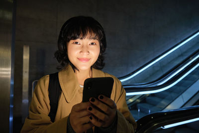 Young woman using mobile phone