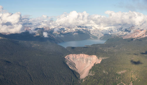 Aerial view of snowcapped mountains against sky