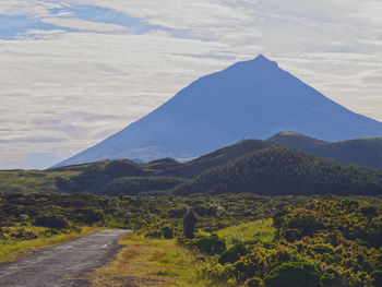 Scenic view of landscape and mountains against sky