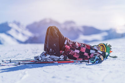 Portrait of boy skiing on snowcapped mountain