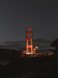 Low angle view of illuminated building against sky at night