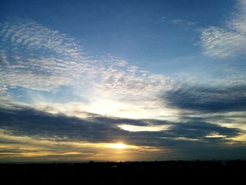 Scenic view of landscape against sky at sunset