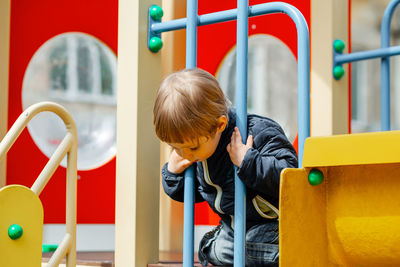 High angle view of boy playing in playground