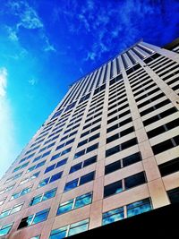 Low angle view of building against blue sky