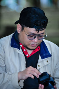 Portrait of young man using mobile phone