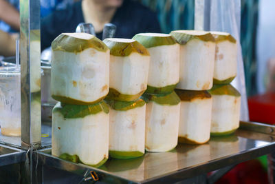 Row of fresh coconut fruit display in ho thi ky street food, ho chi minh city, vietnam