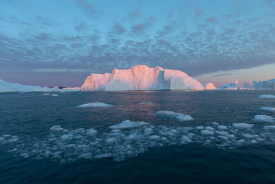 Scenic view of frozen sea against sky