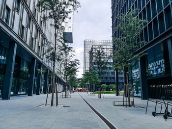 Street amidst buildings against sky