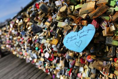 Close-up of padlocks hanging on railing