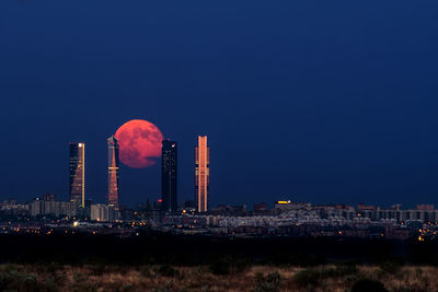 Full moon rising between ctba madrid