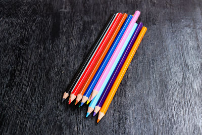 Close-up of colored pencils on table