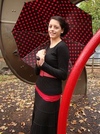 Smiling young woman standing outdoors