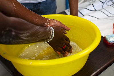 Close-up of woman preparing food in bowl