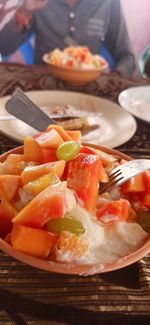 Close-up of fruit salad in plate on table