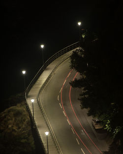 High angle view of illuminated road at night