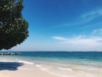 Scenic view of sea against blue sky