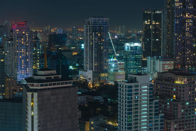 Illuminated buildings in city at night