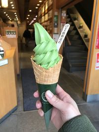 Hand holding ice cream cone