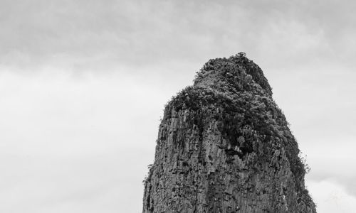 Low angle view of rocks against sky