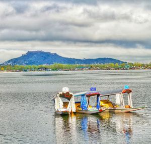 Boat in lake against sky