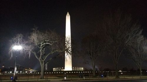 Low angle view of illuminated city at night