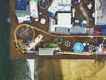 High angle view of swimming pool by river in city