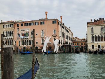 Canal passing through buildings in city