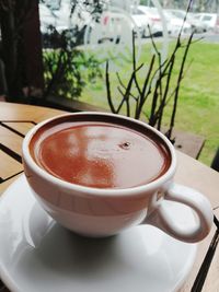 Close-up of coffee cup on table