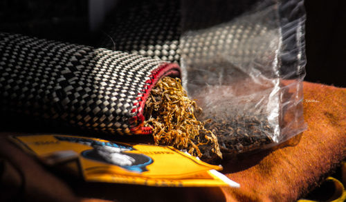 Close-up of marijuana in packet on table