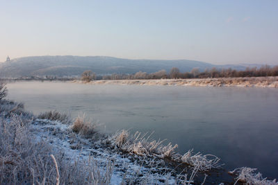 Scenic view of frozen lake against sky