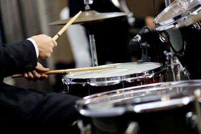 Man playing drum at music concert