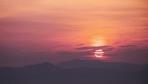 Scenic view of dramatic sky during sunset