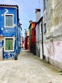 Alley amidst buildings in city