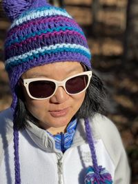 Close-up of woman wearing knit hat outdoors