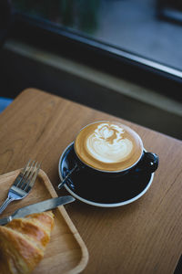 Close-up of cappuccino on table