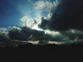 Scenic view of landscape against cloudy sky