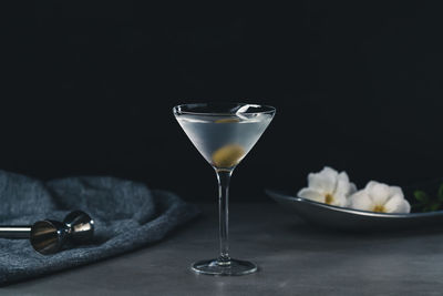 Close-up of wine glasses on table