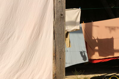 Close-up of clothes drying against water